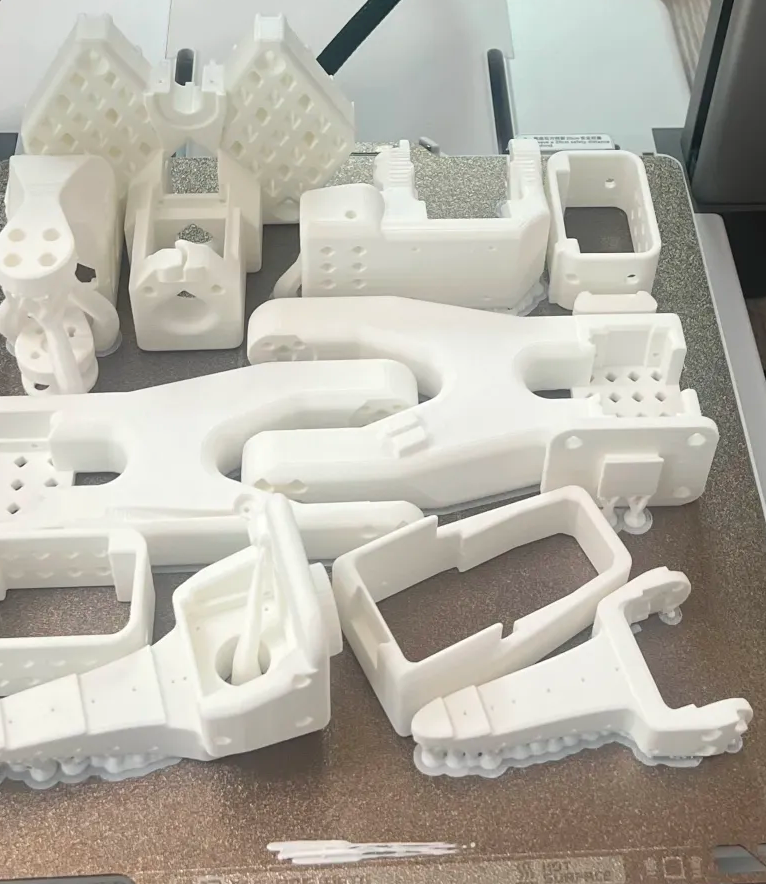 SO-100 arms 3d printed parts, including one follower arm and one leader arm